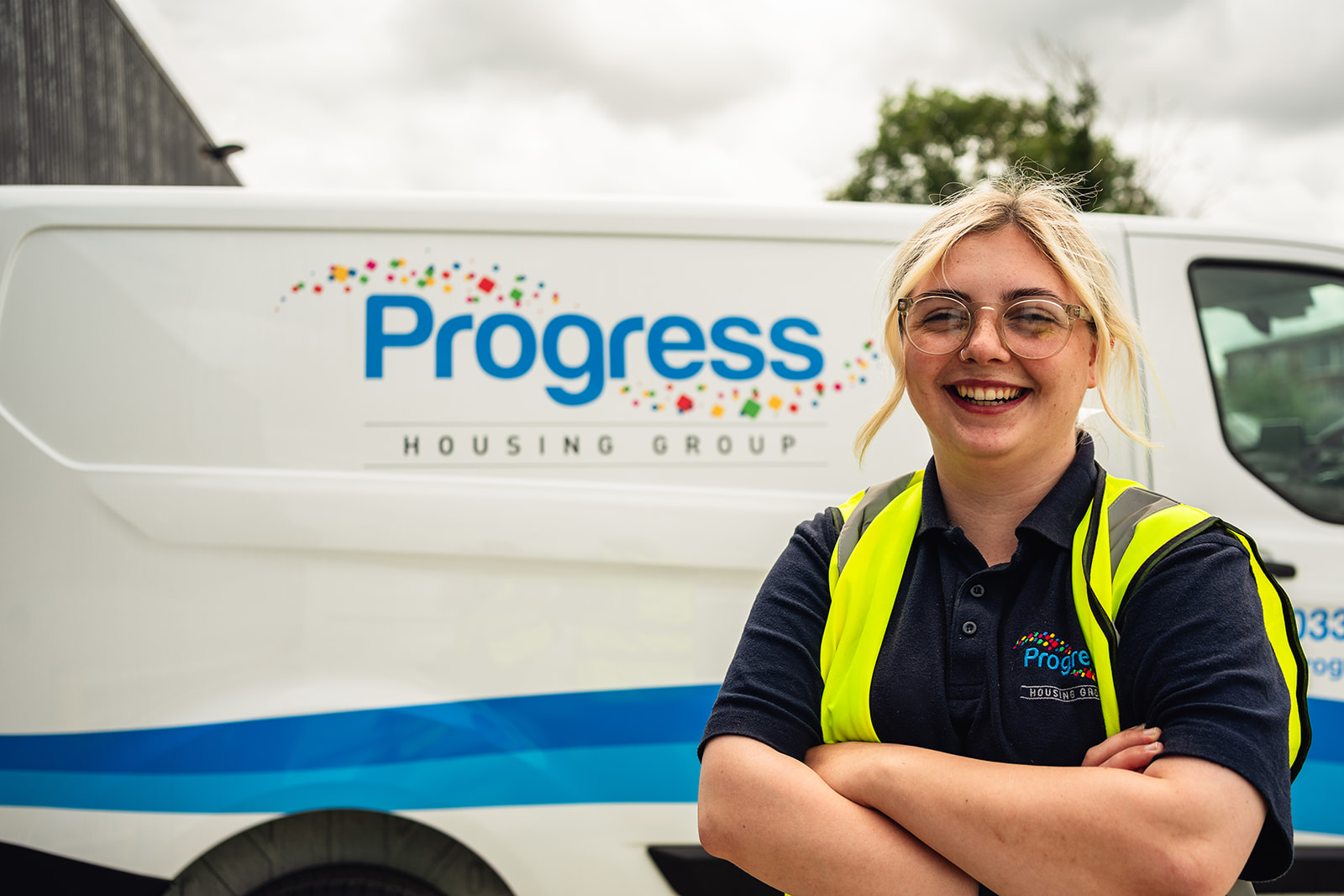 Progress employee in front of her van